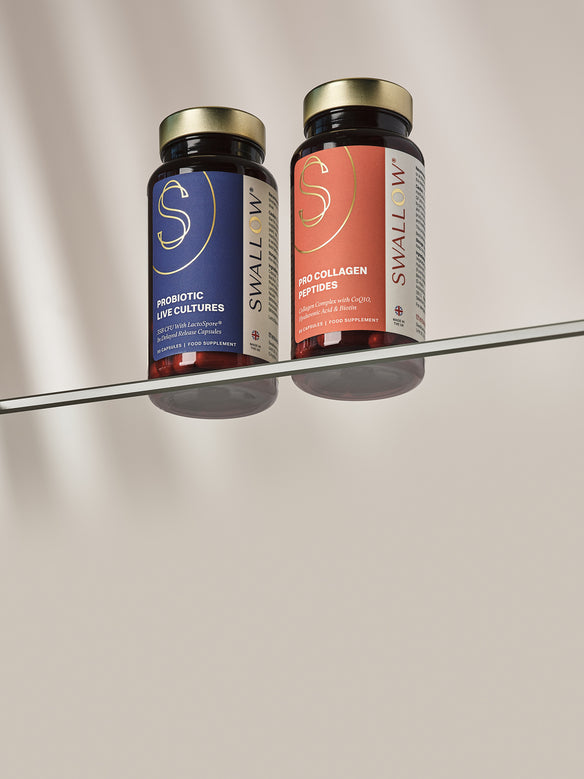 Two Swallow bundle probiotic supplement bottles on a reflective surface with a neutral background