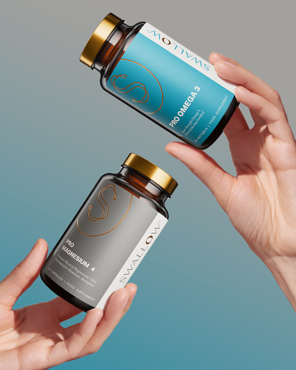 Two Swallow supplement bottles held by hands against a gradient blue background
